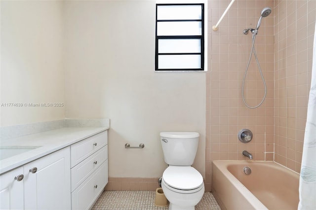 full bathroom featuring toilet, vanity, shower / bath combination with curtain, and tile patterned flooring