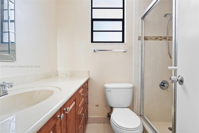 full bathroom with a shower stall, vanity, toilet, tile patterned floors, and baseboards