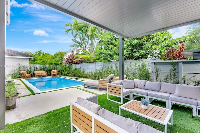 view of swimming pool featuring a fenced backyard, an outdoor living space, a patio area, and a fenced in pool
