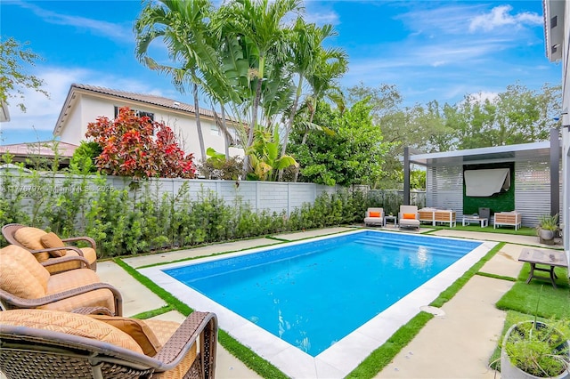 view of swimming pool featuring a fenced backyard, a patio, and a fenced in pool