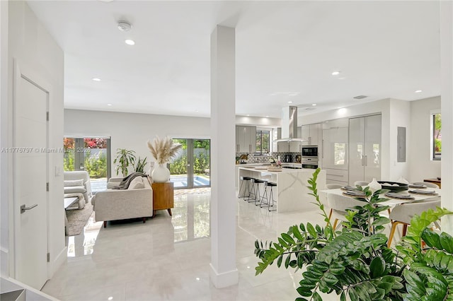 living room with electric panel, french doors, and recessed lighting