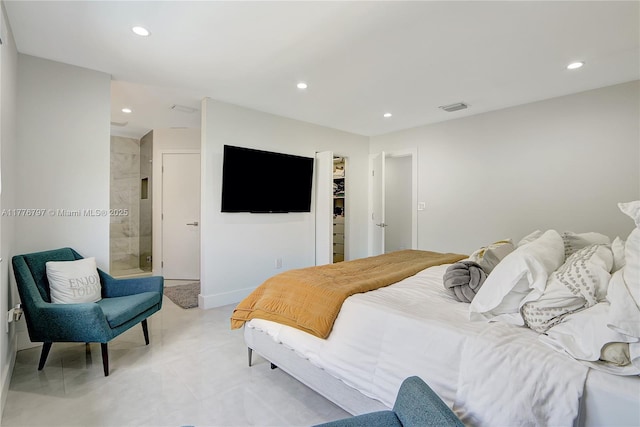 bedroom featuring a spacious closet, visible vents, ensuite bath, and recessed lighting
