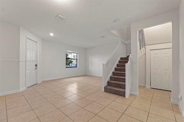 10861 W 32nd Ln Unit 10861, Hialeah, FL 33018 - empty room featuring baseboards, stairs, visible vents, and light tile patterned floors