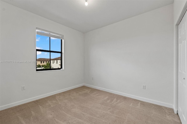 10861 W 32nd Ln Unit 10861, Hialeah, FL 33018 - spare room featuring light colored carpet and baseboards