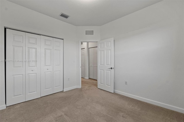 10861 W 32nd Ln Unit 10861, Hialeah, FL 33018 - unfurnished bedroom with carpet flooring, a closet, baseboards, and visible vents