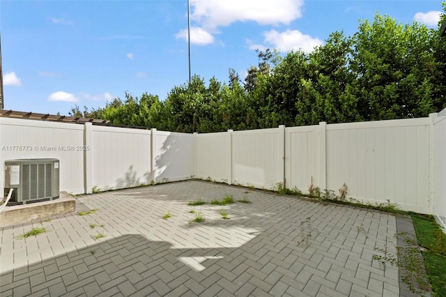 10861 W 32nd Ln Unit 10861, Hialeah, FL 33018 - view of patio / terrace with a fenced backyard and central AC