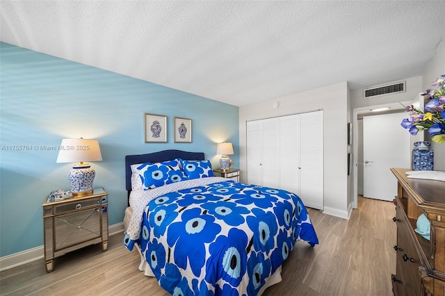 13131 Ixora Ct Unit A-1 A-2 A-3, North Miami, FL 33181 - bedroom featuring visible vents, a closet, baseboards, and wood finished floors