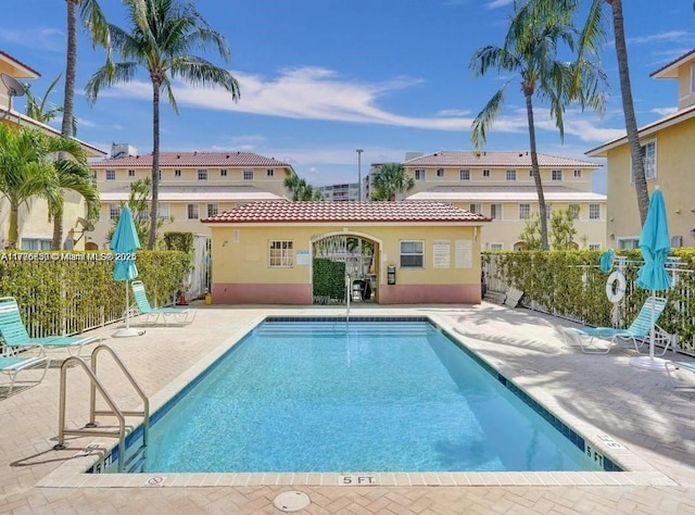 2062 NE 167th St Unit 3-112, North Miami Beach, FL 33162 - community pool featuring a patio area