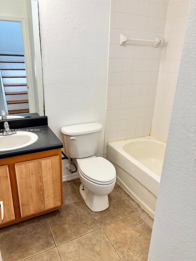 2062 NE 167th St Unit 3-112, North Miami Beach, FL 33162 - full bath with a textured wall, vanity, toilet, tile patterned floors, and  shower combination