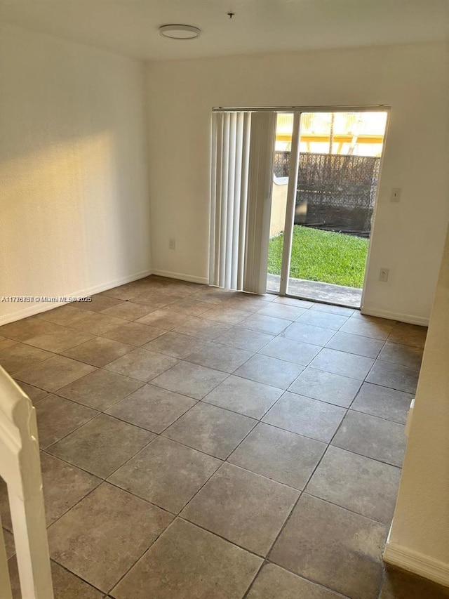 2062 NE 167th St Unit 3-112, North Miami Beach, FL 33162 - tiled empty room with baseboards