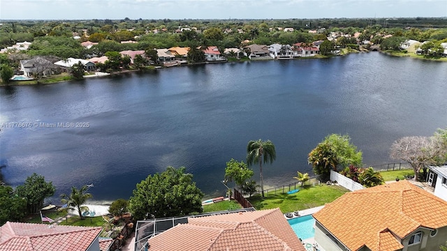 birds eye view of property with a residential view and a water view