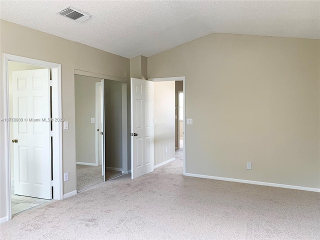 10521 SW 13th Ct, Pembroke Pines, FL 33025 - unfurnished bedroom featuring visible vents, carpet flooring, vaulted ceiling, and a textured ceiling