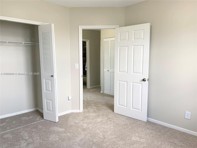 10521 SW 13th Ct, Pembroke Pines, FL 33025 - unfurnished bedroom featuring a closet, baseboards, and carpet floors