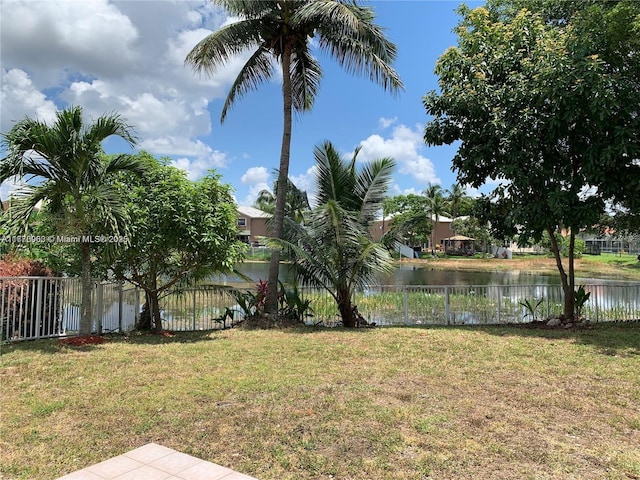 10521 SW 13th Ct, Pembroke Pines, FL 33025 - view of yard with fence and a water view