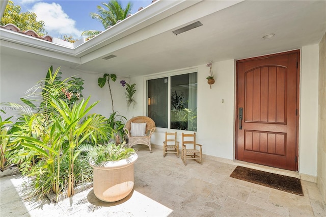 10619 NE 10th Pl, Miami Shores, FL 33138 - view of exterior entry with stucco siding