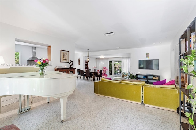 10619 NE 10th Pl, Miami Shores, FL 33138 - living area featuring speckle patterned floor
