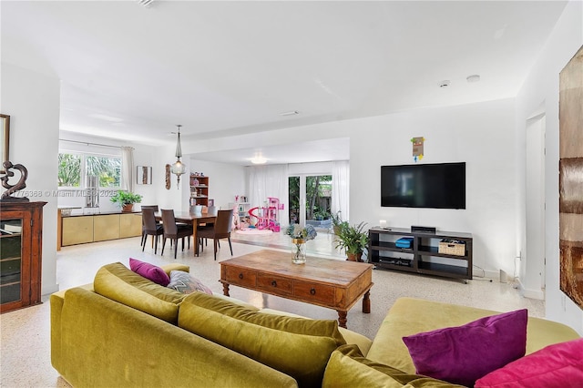 10619 NE 10th Pl, Miami Shores, FL 33138 - living area featuring dark aggregate flooring