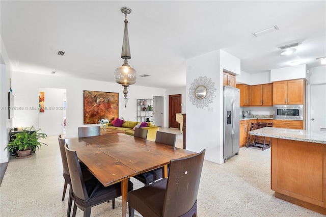 10619 NE 10th Pl, Miami Shores, FL 33138 - dining room with light speckled floor and visible vents