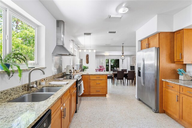 10619 NE 10th Pl, Miami Shores, FL 33138 - kitchen featuring stainless steel fridge with ice dispenser, wall chimney exhaust hood, electric stove, a peninsula, and brown cabinetry