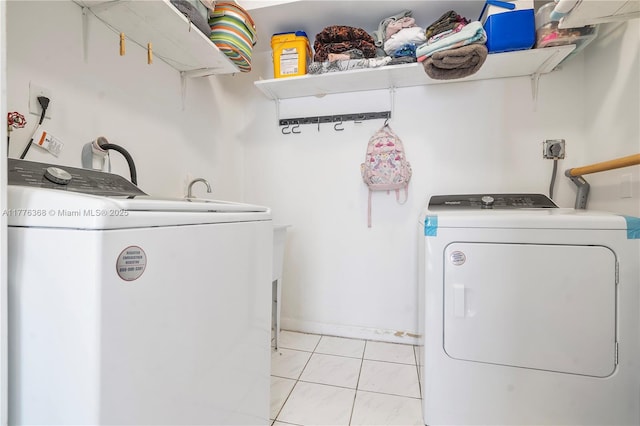 10619 NE 10th Pl, Miami Shores, FL 33138 - laundry room featuring washer and clothes dryer and baseboards