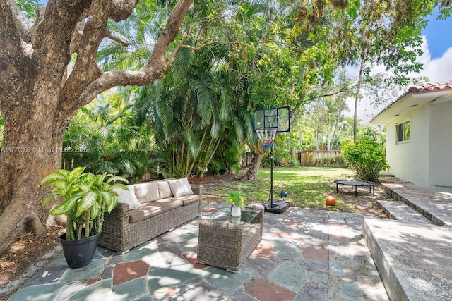 10619 NE 10th Pl, Miami Shores, FL 33138 - fenced backyard with an outdoor living space and a patio area