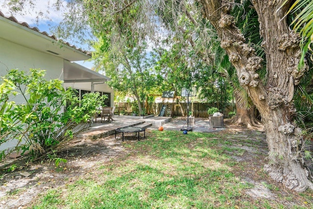 10619 NE 10th Pl, Miami Shores, FL 33138 - view of yard featuring a patio