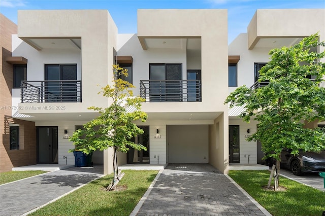contemporary house featuring stucco siding