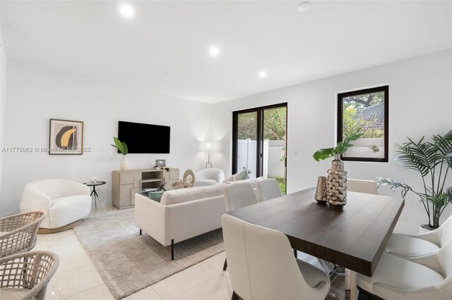 living area featuring light tile patterned floors and recessed lighting