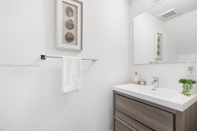 bathroom with vanity and visible vents