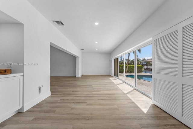 872 NE 79, Boca Raton, FL 33487 - empty room featuring baseboards, recessed lighting, and light wood finished floors