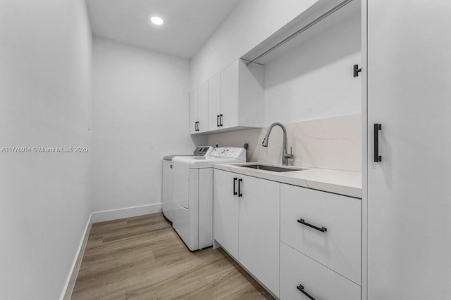 872 NE 79, Boca Raton, FL 33487 - washroom with separate washer and dryer, baseboards, cabinet space, light wood-style floors, and recessed lighting