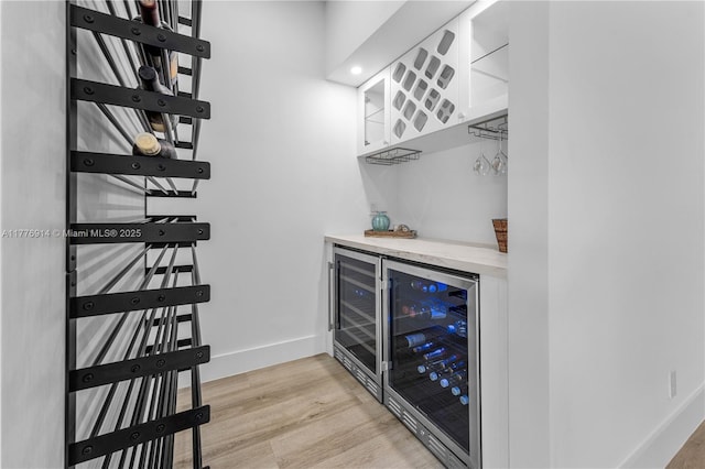 872 NE 79, Boca Raton, FL 33487 - indoor dry bar with wine cooler, light wood-type flooring, and baseboards