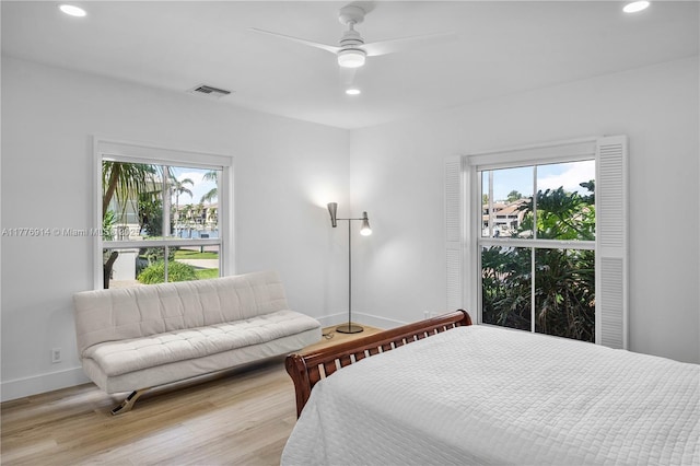 872 NE 79, Boca Raton, FL 33487 - bedroom featuring recessed lighting, multiple windows, wood finished floors, baseboards, and ceiling fan