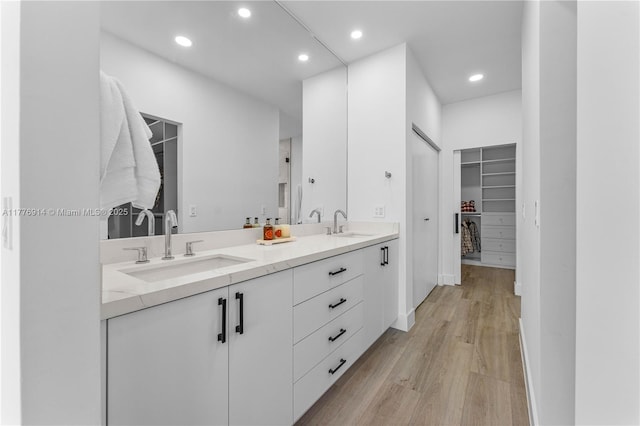 872 NE 79, Boca Raton, FL 33487 - full bath with a walk in closet, wood finished floors, double vanity, and recessed lighting