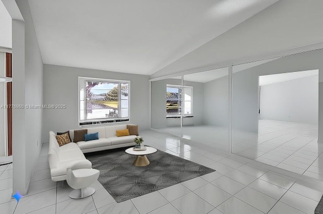 3881 Hidden Cypress Way, Lake Worth, FL 33467 - living room featuring vaulted ceiling and tile patterned flooring