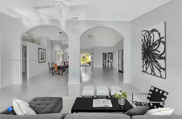 3881 Hidden Cypress Way, Lake Worth, FL 33467 - tiled living area with arched walkways and ceiling fan