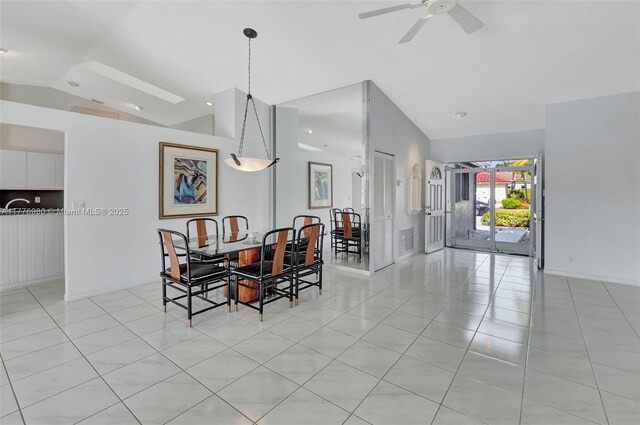 3881 Hidden Cypress Way, Lake Worth, FL 33467 - dining room featuring vaulted ceiling, a ceiling fan, light tile patterned floors, and baseboards