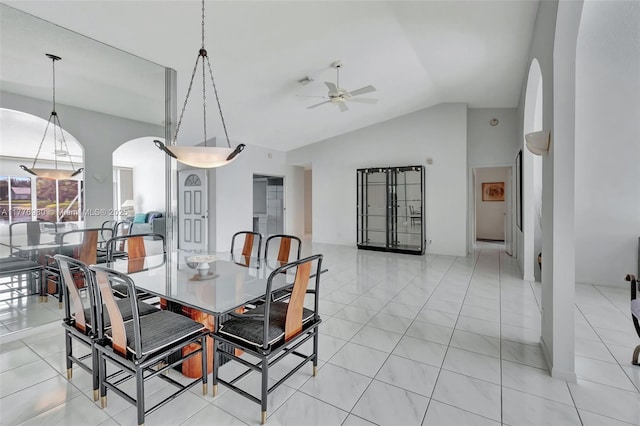 3881 Hidden Cypress Way, Lake Worth, FL 33467 - dining area featuring arched walkways, a ceiling fan, lofted ceiling, and light tile patterned floors