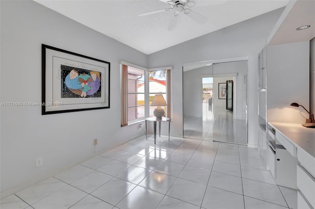 3881 Hidden Cypress Way, Lake Worth, FL 33467 - empty room with lofted ceiling, a ceiling fan, and light tile patterned floors
