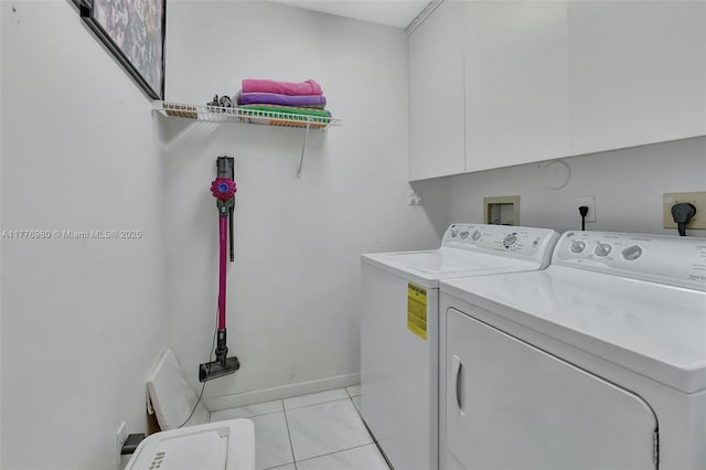3881 Hidden Cypress Way, Lake Worth, FL 33467 - washroom with washing machine and dryer, cabinet space, and light tile patterned floors