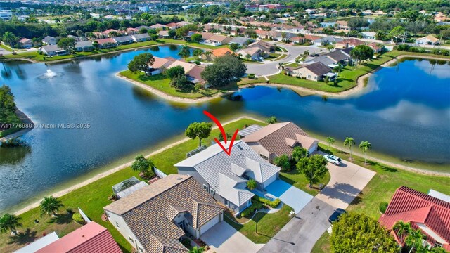 3881 Hidden Cypress Way, Lake Worth, FL 33467 - aerial view of residential area with a large body of water