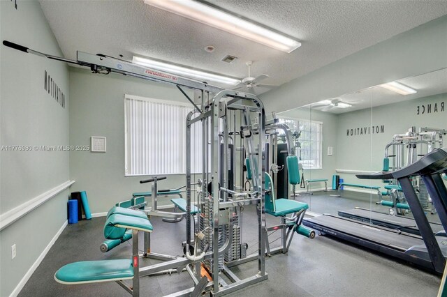 3881 Hidden Cypress Way, Lake Worth, FL 33467 - workout area with a ceiling fan, a textured ceiling, and baseboards