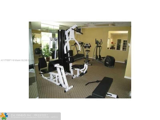 gym featuring baseboards