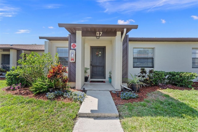 6034 Indrio Rd Unit 7, Fort Pierce, FL 34951 - doorway to property with stucco siding
