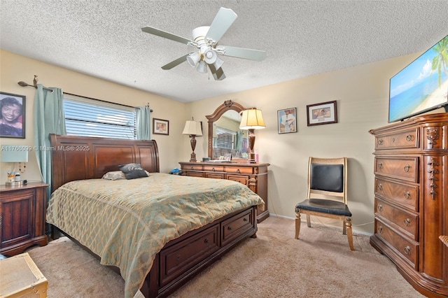 6034 Indrio Rd Unit 7, Fort Pierce, FL 34951 - bedroom featuring light carpet, baseboards, a textured ceiling, and a ceiling fan