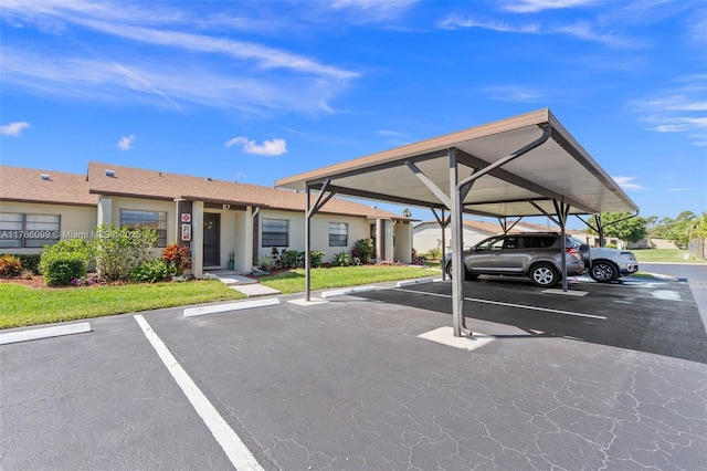 6034 Indrio Rd Unit 7, Fort Pierce, FL 34951 - view of partially covered parking lot