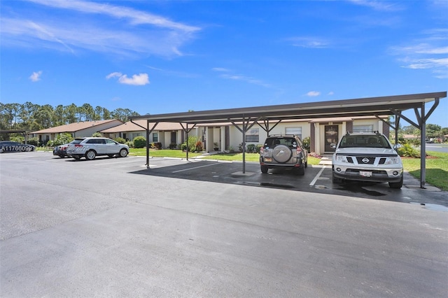 6034 Indrio Rd Unit 7, Fort Pierce, FL 34951 - view of partially covered parking lot
