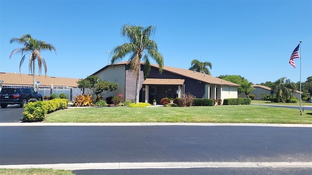 6034 Indrio Rd Unit 7, Fort Pierce, FL 34951 - view of front of property with fence and a front lawn