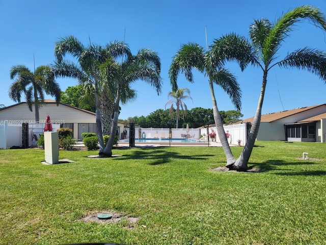 6034 Indrio Rd Unit 7, Fort Pierce, FL 34951 - view of yard featuring a fenced in pool and fence private yard