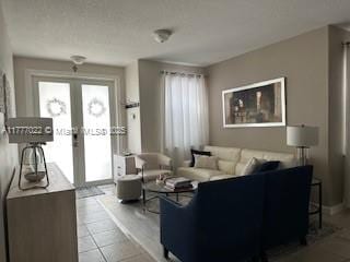 4833 NW 108th Path, Doral, FL 33178 - living area featuring tile patterned flooring and french doors